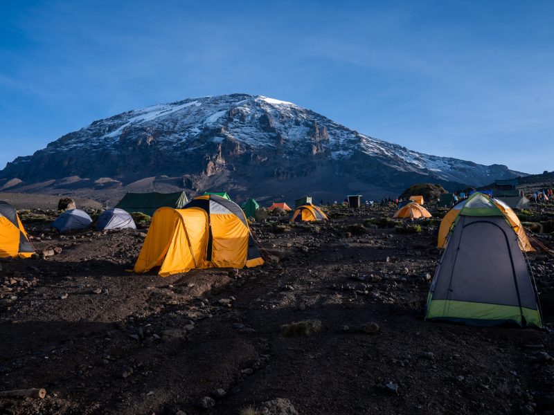 Camping on mount Kilimanjaro in tents to see the glaciers in Tan